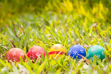 Painted Easter eggs put on the straw in the grass,easter day