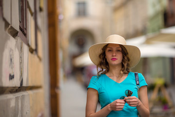 Woman in ancient city, street background, medieval