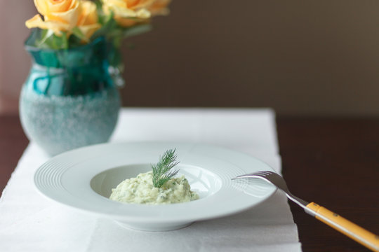 Mashed potatoes with dill in white plate