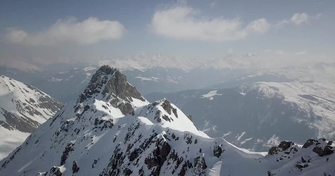 Drone video footage of the Alps with sunny weather and clear skies