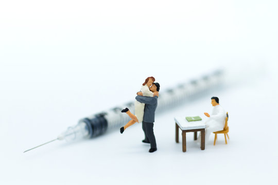 Miniature people: Couples with physical examination before marriage. Image use for Family readiness, health care concept.