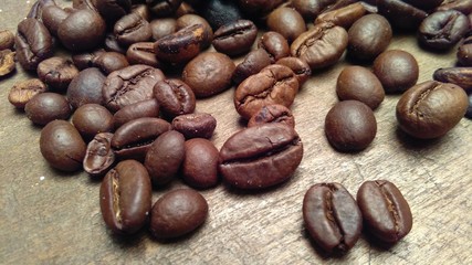 coffee beans on wooden background. close-up