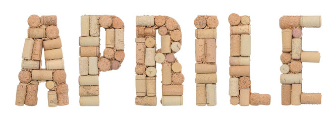 Word April in Italian Aprile made of wine corks isolated on white