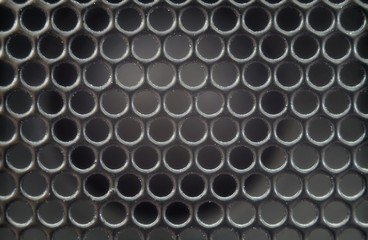 Texture background of an old speaker grille