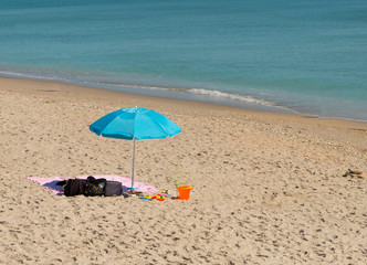 Fototapeta na wymiar Blue beach umbrella 2