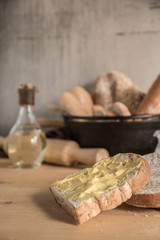 Different kinds of bread rolls on table wooden from above. Kitchen or bakery poster design