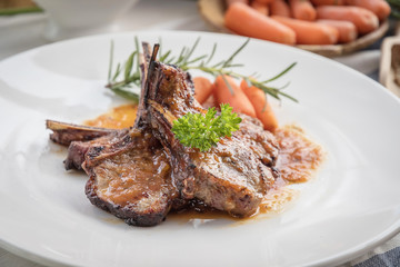 lamb steak on white plate