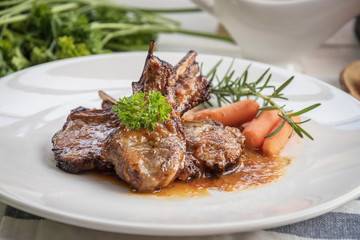 lamb steak on white plate