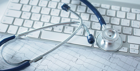 Close up of stethoscope on pc keyboard. Healthcare concept