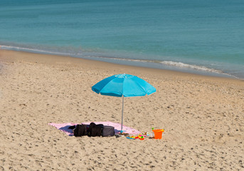 Fototapeta na wymiar Blue beach umbrella 1