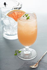 Variety of citrus cocktails on gray surface