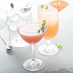 Variety of citrus cocktails on gray surface