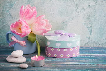 Pink tulip flowers in blue mug