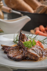 lamb steak on white plate