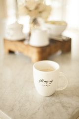 Coffee mug on counter in white kitchen