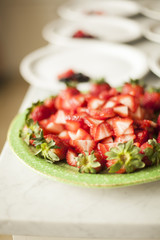 Plate of prepared red, fresh strawberries