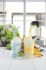 Mint with banana smoothies arranged on wood table