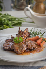 lamb steak on white plate