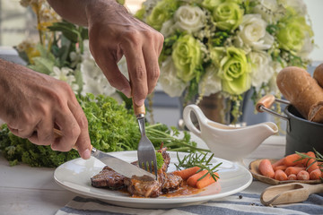 lamb steak on white plate