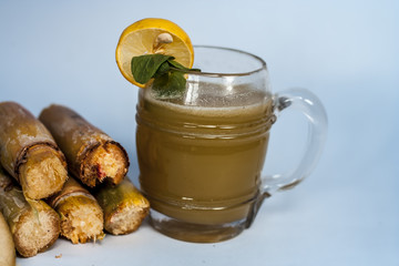 Popular Indian/Asian Ganne ka ras or Sugar cane or Saccharum officinarum juice in a transparent...