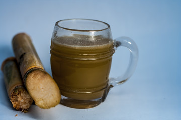 Popular Indian/Asian Ganne ka ras or Sugar cane or Saccharum officinarum juice in a transparent...