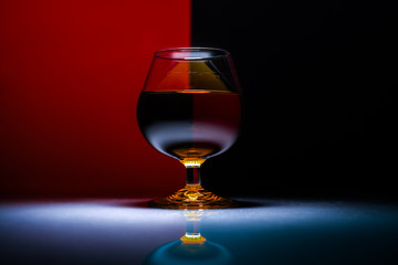A glass of wine on abstract background.