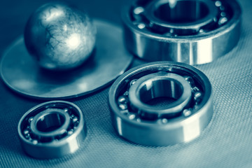 Diameter measurement with calipers, bearings, toned.