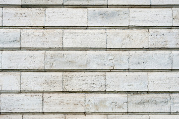 Old stone cladding plates on the wall closeup