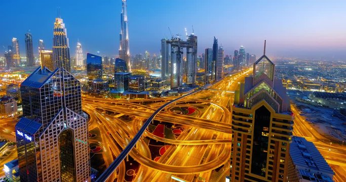 DUBAI, UNITED ARAB EMIRATES, MARCH 22 2018: Dubai Busy Intersection Timelapse at Night. Dubai traffic Scene Time Lapse with busy rush hour. 