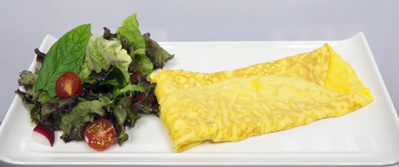 With omelets and greens - 198637452