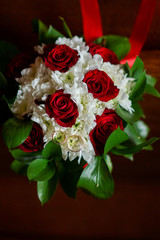 tender beautiful bridal bouquet of flowers on wooden steps