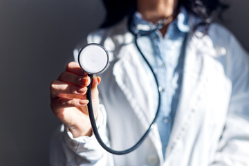 Close up view of doctor holding stethoscope