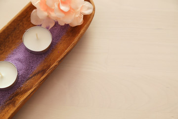 Obraz na płótnie Canvas Beautiful composition of spa treatment on white wooden table . spa concept with bath salt .