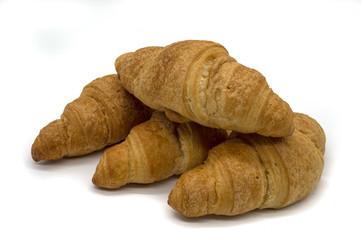 Four Crispy Brown Croissants on a white Background