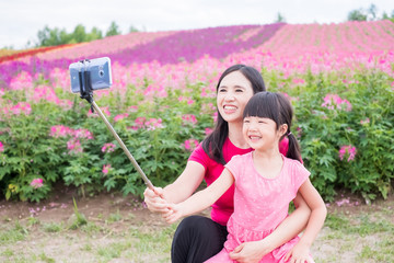 mother and daughter selfie happily