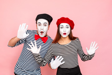 Closeup portrait of handsome couple with shocked face