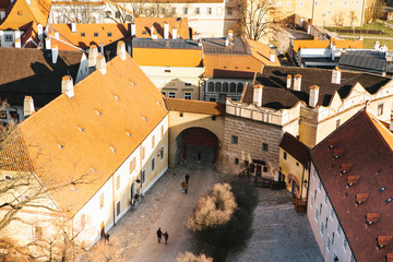 A view from the air to beautiful authentic houses and streets in the town of Cesky Krumlov in the...