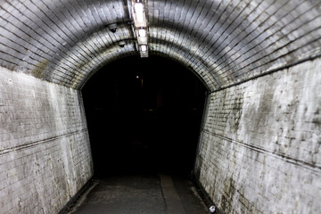 Fototapeta na wymiar Spooky desolate tunnel - a dangerous place in London, certain to be a crime hub