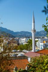 Obraz premium View to the buildings of the Marmaris resort town in Marmaris, Turkey. Mosque