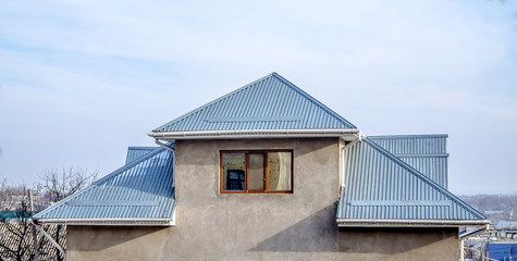 The roof of the house is made of galvanized metal
