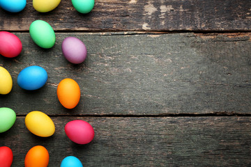 Fototapeta na wymiar Colorful easter eggs on grey wooden table