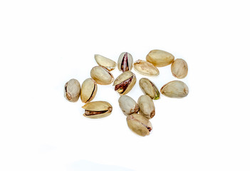 Salted pistachio nuts on white background