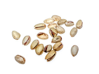Salted pistachio nuts on white background