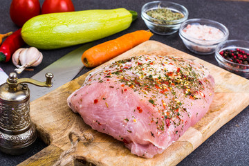 Piece of turkey fillet, marinated in spices, fresh vegetables for cooking