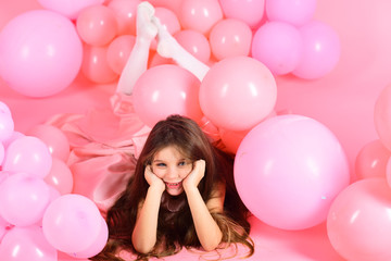 Fototapeta na wymiar Funny little girl on background of bright pink wall