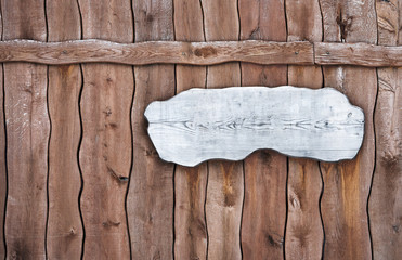 wooden plaque on a wooden fence