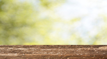 Fototapeta premium Empty wooden table with spring background