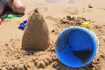 building a sand castle on the beach