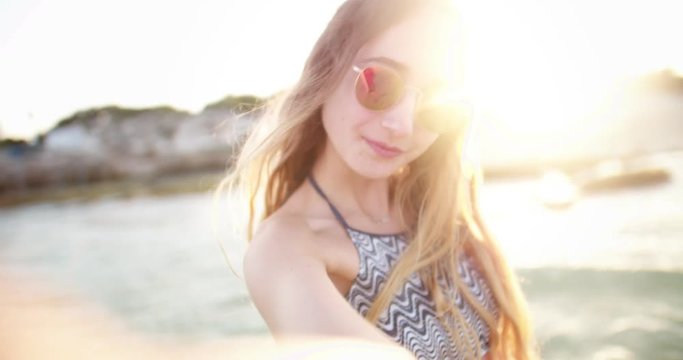 Beautiful hipster teenage girl having fun at the beach