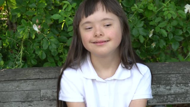 Down syndrome girl have fun outside
